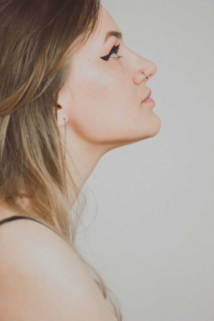 TESTIMONIOS Side Portrait of a Young Woman with Nose Piercing